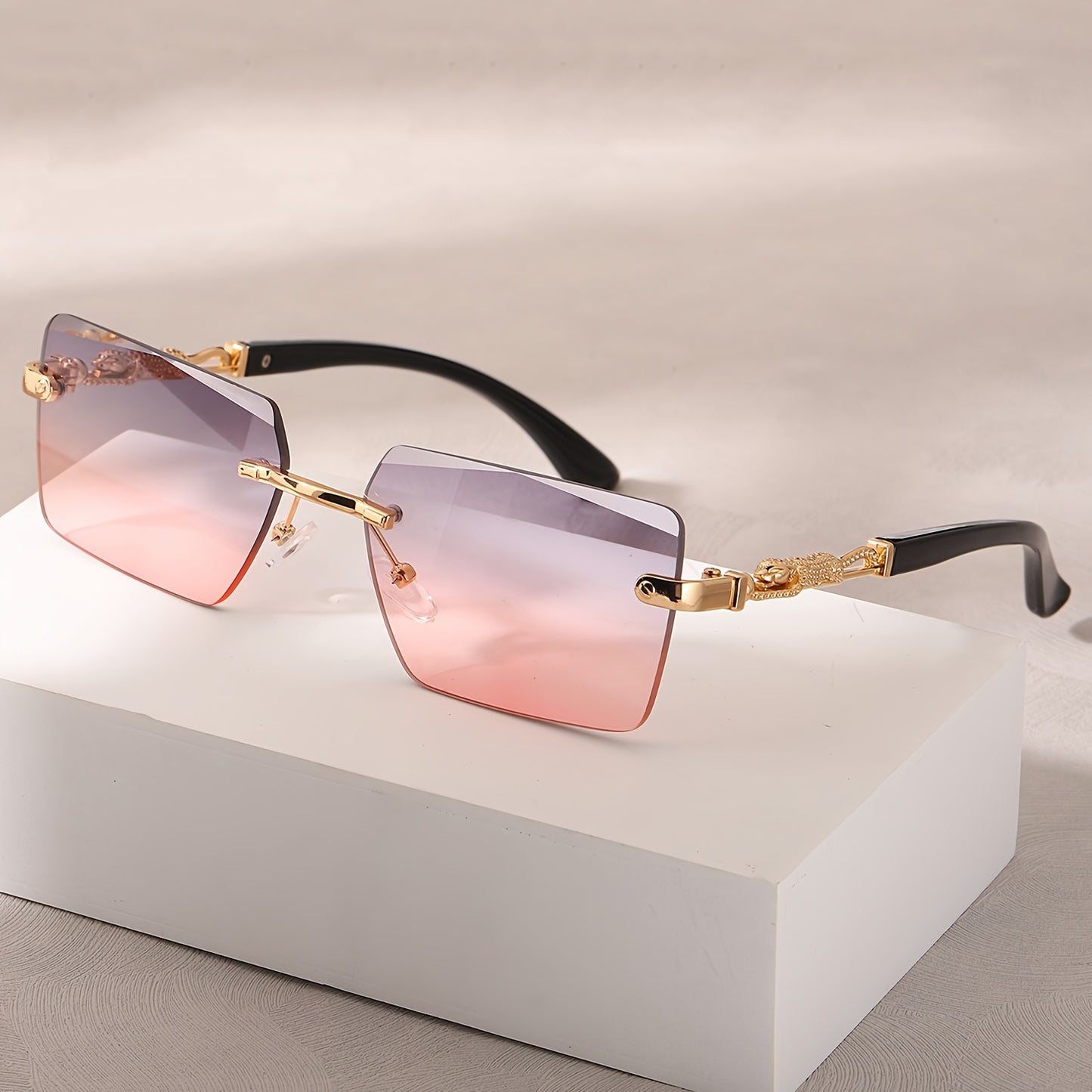 A pair of fashionable glasses with a retro style, featuring rimless leopard print temples and a compact trendy frame