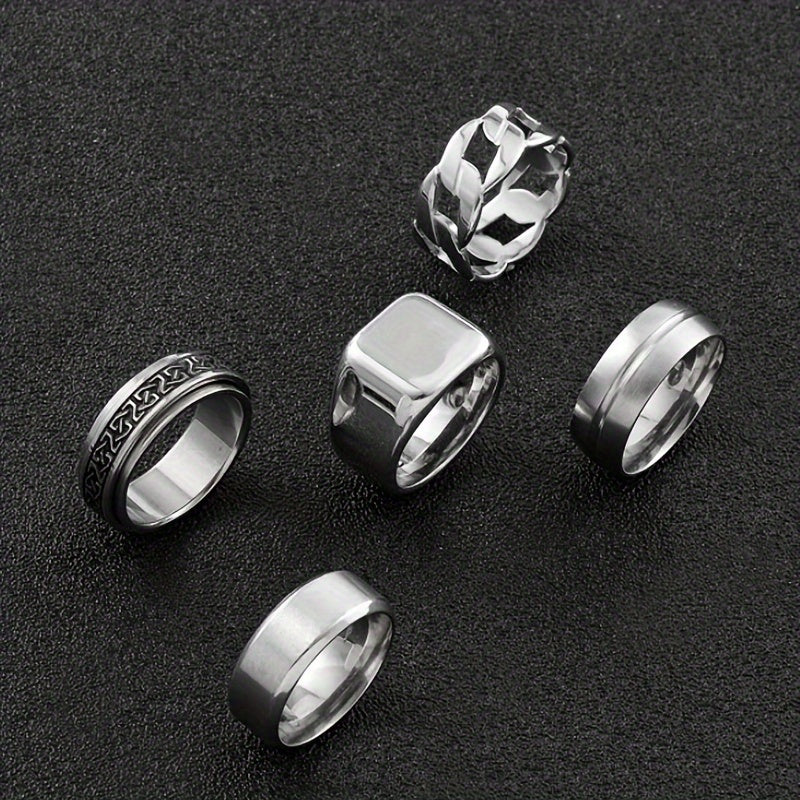 A Set of 5 Stylish Stainless Steel Rings Featuring Rotating Black Geometric Designs, Simple Hollow Rings, Perfect for Men'S Wedding Or Dating Accessories.