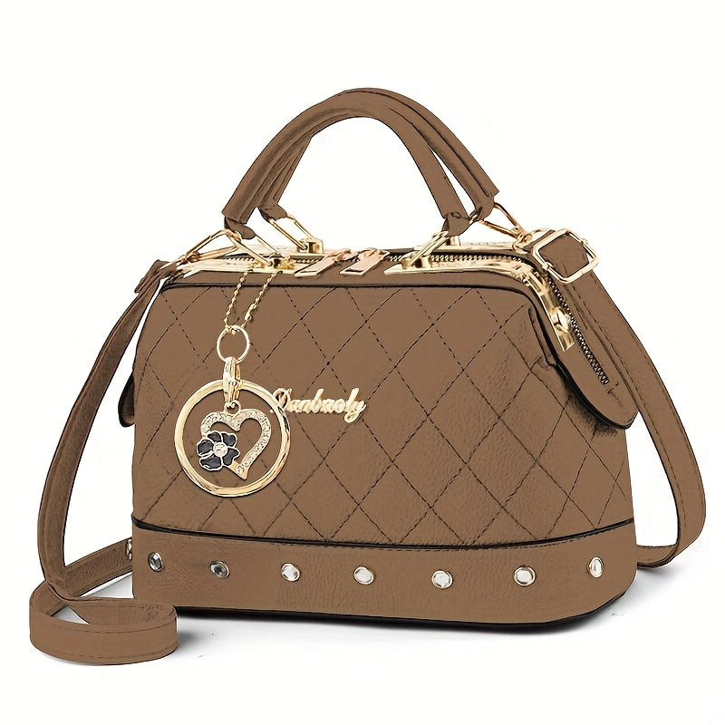 Black Quilted Boston Bag with Golden-Tone Hardware & Adjustable Strap - Elegant Heart Rhinestone Charm, Pattern, and Stylish Stud Details for Wo