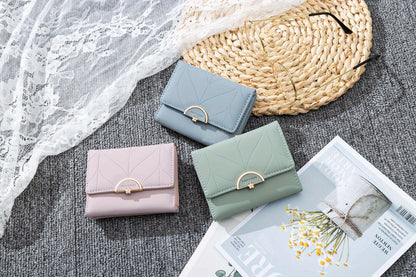 Compact Trifold Wallet for Women in Mint Green Featuring a Golden Clasp And Zippered Coin Compartment, Adorned with a Floral Pattern And Designed for Multiple Card Storage