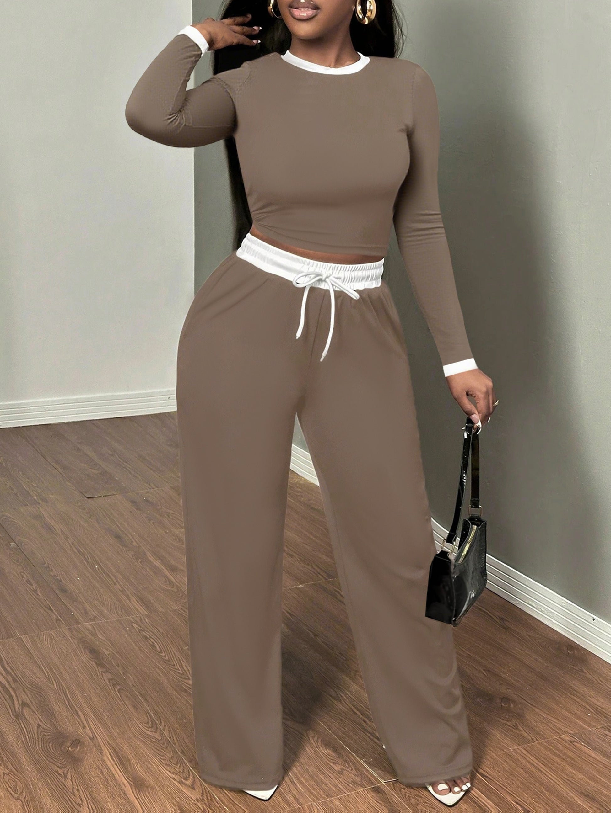 A Two-Piece Set Featuring a Sexy Color-Block Round-Neck Long-Sleeve T-Shirt Paired with High-Waisted Belted Trousers - ayq