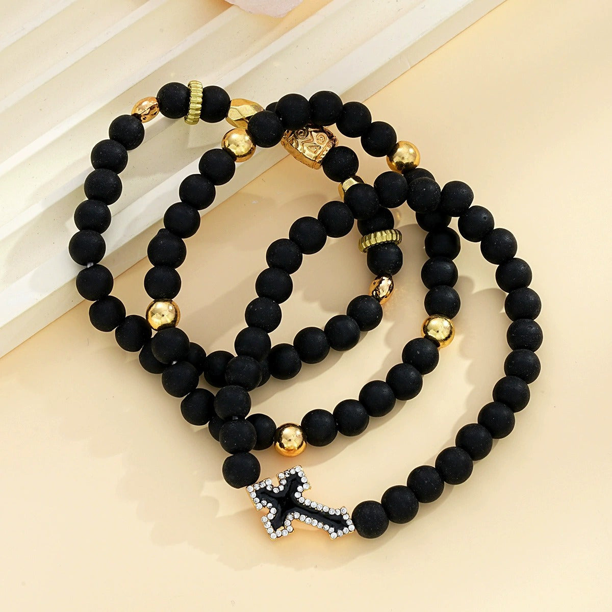 A Set of Three Men'S Bracelets Featuring Black Beads And Cross Decorations, Perfect for Mature Men. These Accessories Are Suitable for Everyday Wear And Make Great Gifts for Men.