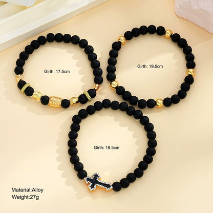 A Set of Three Men'S Bracelets Featuring Black Beads And Cross Decorations, Perfect for Mature Men. These Accessories Are Suitable for Everyday Wear And Make Great Gifts for Men.